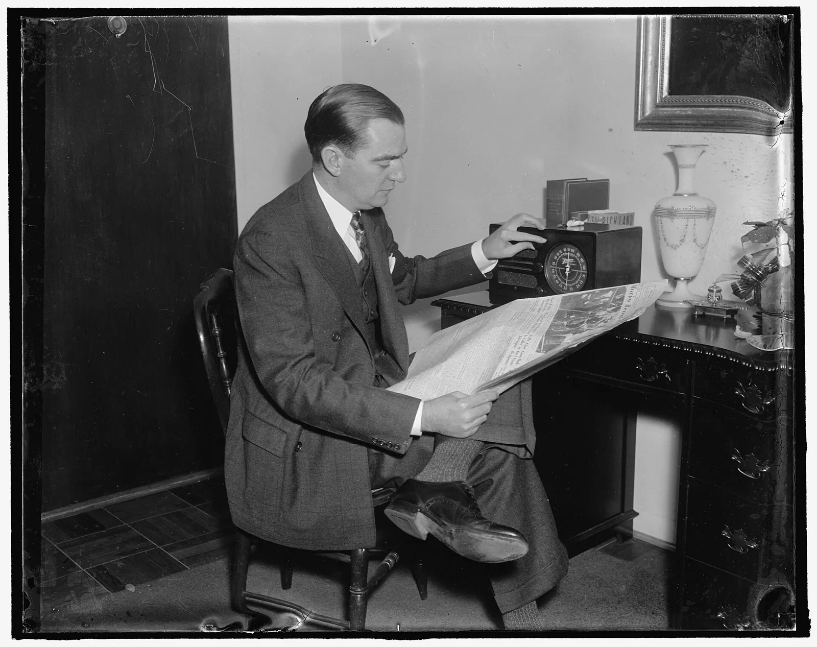 Title: A congressman's day. 6:30 P.M. Home again, Rep. Thomas reads the hometown newspapers and listens to the latest radio news reports before dinner, 12/31/37 Abstract/medium: 1. How to read a weather alert before publishing