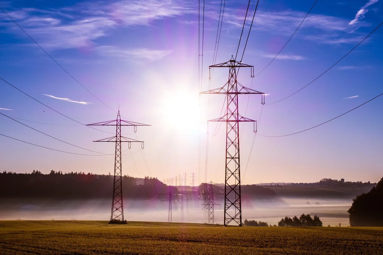pylon, cables, sunrise, sunlight, sun, fog, mist, field, meadow, transmission towers, power towers, nature, utility poles, power lines, overhead power lines, power supply, electricity, morning hour, dawn, morning, landscape. What Is a Rate Case? How US Utility Regulators Set Your Electric Rates