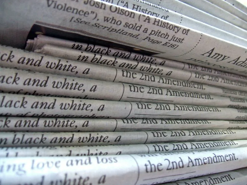 A close view of stacked printed newspapers