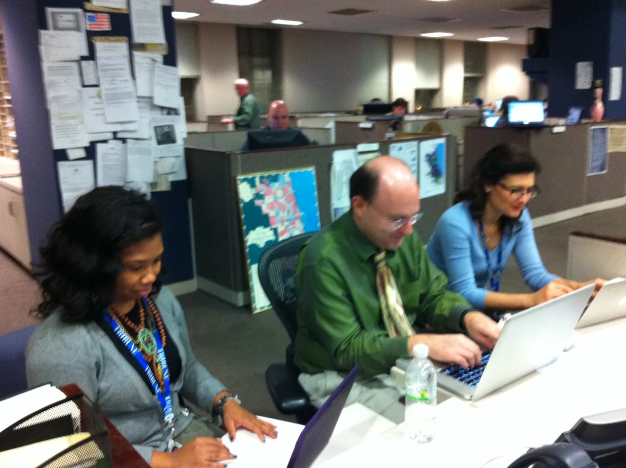 Journalists working at laptops in the Chicago Tribune newsroom on election night in 2012